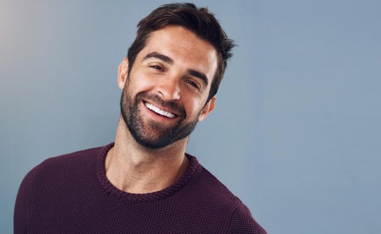 Happy, man and portrait with mockup for confidence, pride and positive attitude isolated in studio. Smile, male person or model with commercial space for pride and optimism with gray background